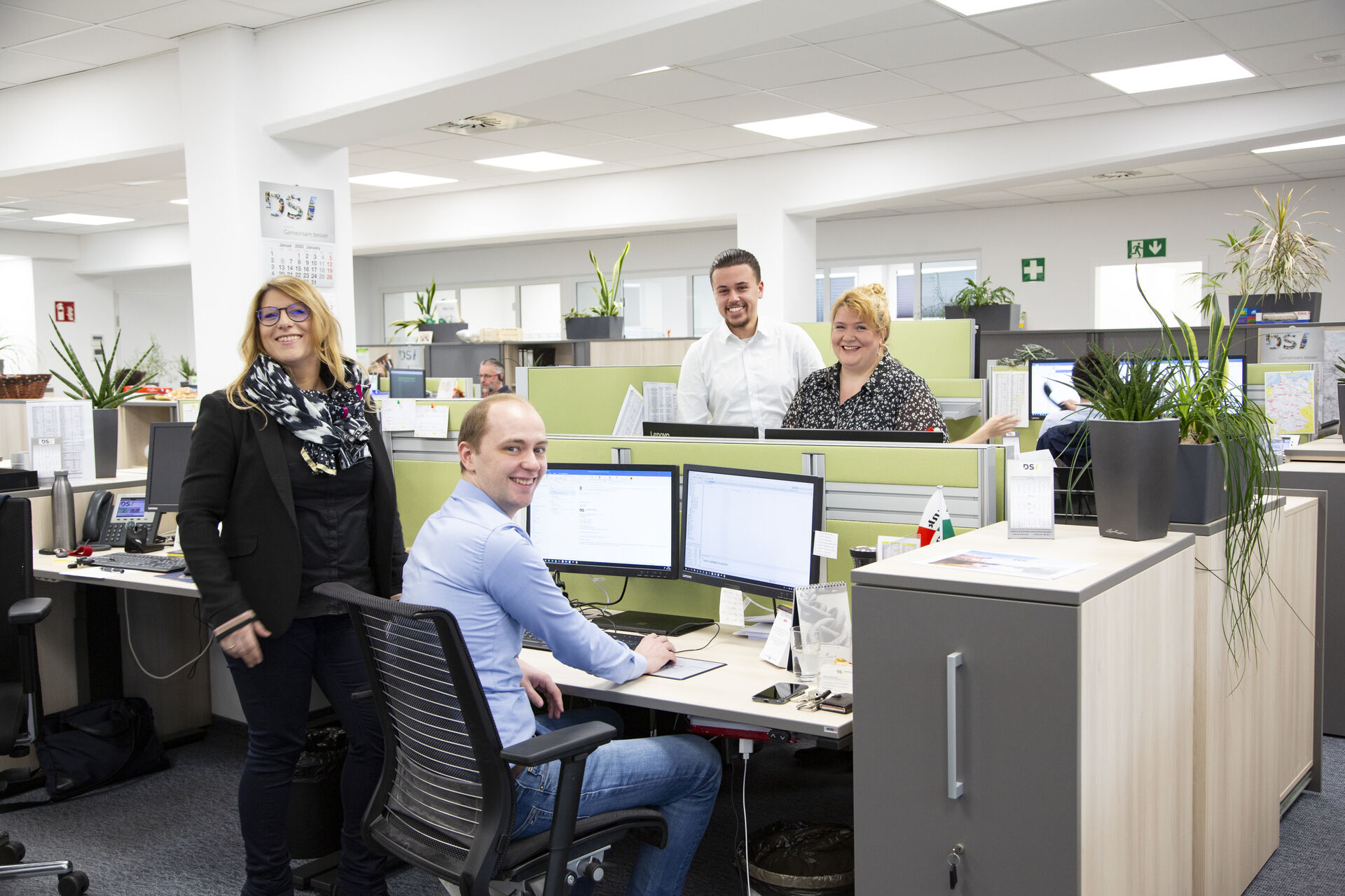 Photo of the logistics team in their office